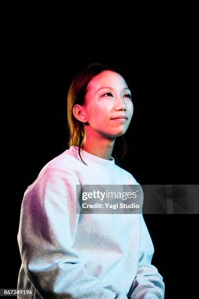 portrait of mid adult japanese women - multi colored shirt foto e immagini stock