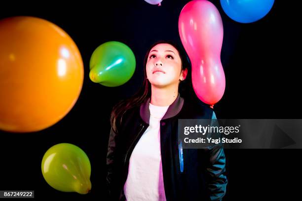 portrait of mid adult japanese women with colorful balloon - multi coloured choice stock pictures, royalty-free photos & images