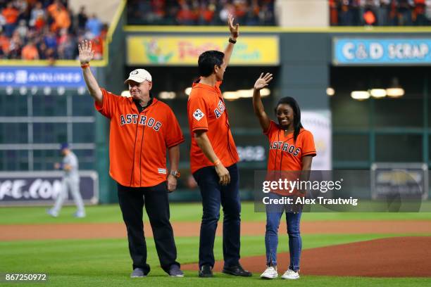 Astronaut Scott Kelly, Houston Dynamo legend Brian Ching and gold medal Olympian Simone Biles wave to the crowd during the pre-game ceremony prior to...