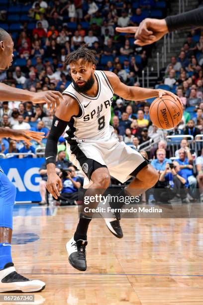 Patty Mills of the San Antonio Spurs handles the ball against the Orlando Magic on October 27, 2017 at Amway Center in Orlando, Florida. NOTE TO...