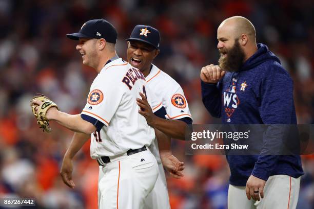 Brad Peacock celebrates with teammates after defeatng the Los Angeles Dodgers in game three of the 2017 World Series at Minute Maid Park on October...