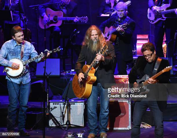 Jamey Johnson is joined on stage by Jimmy Melton and Brent Mason during the Country Music Hall of Fame and Museum Medallion Ceremony to celebrate...