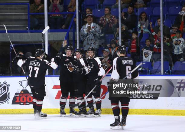 Tyler Benson of the Vancouver Giants celebrates his goal against the Prince George Cougars with teammates during the third period of their WHL game...