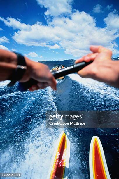 waterskiing, skier's view towards boat - wasserskifahren stock-fotos und bilder