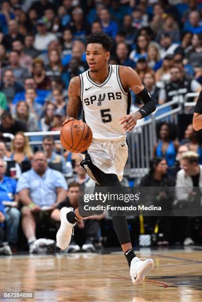 Dejounte Murray of the San Antonio Spurs handles the ball against the Orlando Magic on October 27, 2017 at Amway Center in Orlando, Florida. NOTE TO...