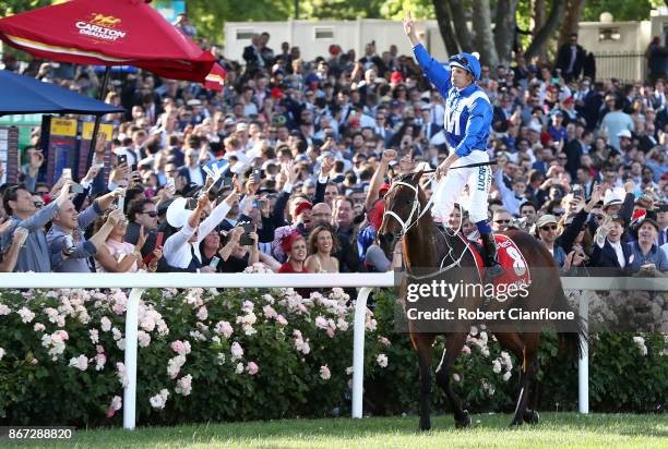 Hugh Bowman riding Winx, celebrates after winning race nine the Ladbrokes Cox Plate during Cox Plate Day at Moonee Valley Racecourse on October 28,...