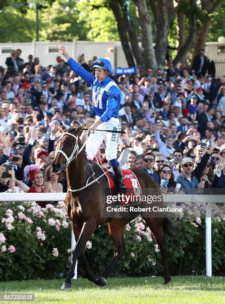 Hugh Bowman riding Winx, celebrates after winning race nine the Ladbrokes Cox Plate during Cox Plate Day at Moonee Valley Racecourse on October 28,...