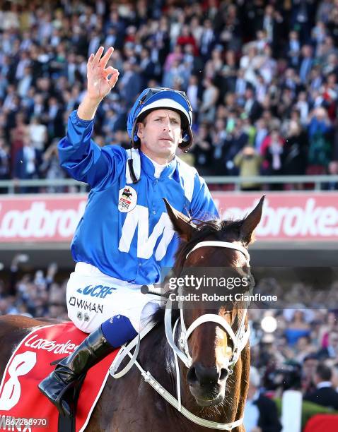 Hugh Bowman riding Winx, celebrates after winning race nine the Ladbrokes Cox Plate during Cox Plate Day at Moonee Valley Racecourse on October 28,...