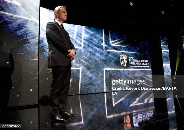 Christopher Nolan speaks onstage at the 2017 AMD British Academy Britannia Awards Presented by American Airlines And Jaguar Land Rover at The Beverly...