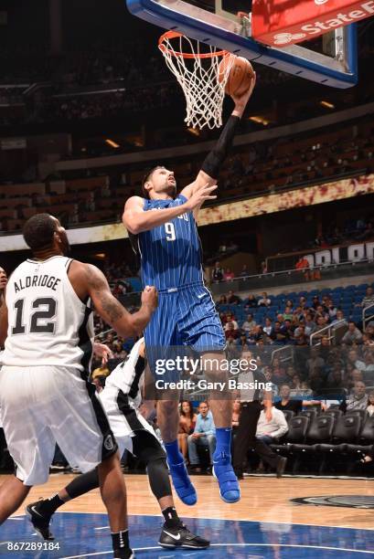 Nikola Vucevic of the Orlando Magic drives to the basket against the San Antonio Spurs on October 27, 2017 at Amway Center in Orlando, Florida. NOTE...