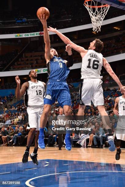 Nikola Vucevic of the Orlando Magic drives to the basket against the San Antonio Spurs on October 27, 2017 at Amway Center in Orlando, Florida. NOTE...