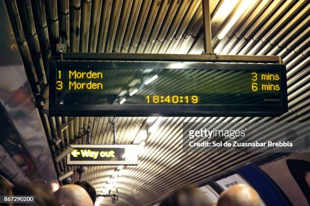 sign. underground. rush hour. - london underground train stock pictures, royalty-free photos & images