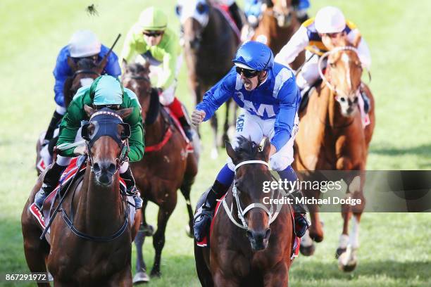 Winx ridden by Hugh Bowman beats Blake Shinn riding Humidor to win race 9 the Ladbrokes Cox Plate during Cox Plate Day at Moonee Valley Racecourse on...