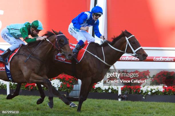 Hugh Bowman riding Winx defeats Blake Shinn riding Humidor in Race 9, Ladbrokes Cox Plate during Cox Plate Day at Moonee Valley Racecourse on October...