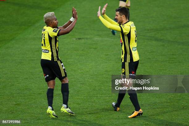 Roy Krishna and Dario Vidosic of the Phoenix celebrate the goal of Andrija Kaludjerovic during the round four A-League match between the Wellington...