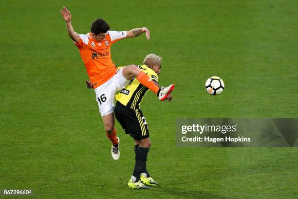 Mitchell Oxborrow of Brisbane challenges Roy Krishna of the Phoenix during the round four A-League match between the Wellington Phoenix and the...