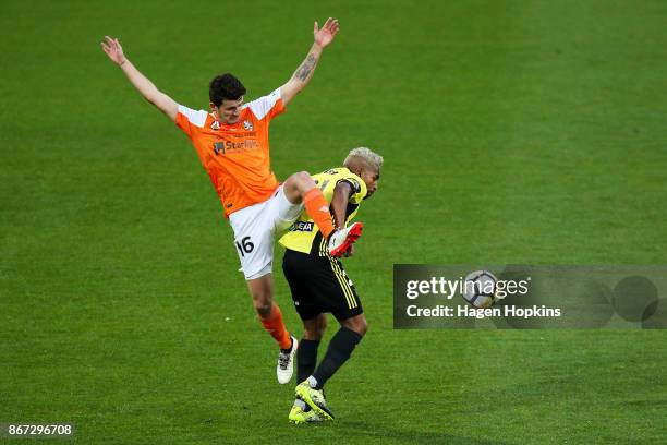 Mitchell Oxborrow of Brisbane challenges Roy Krishna of the Phoenix during the round four A-League match between the Wellington Phoenix and the...