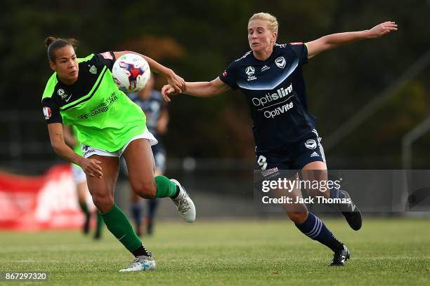 Toni Pressley of Canberra and Natasha Dowie of the Victory compete for the ball before Natasha Downie scores a goal in the second half during the...