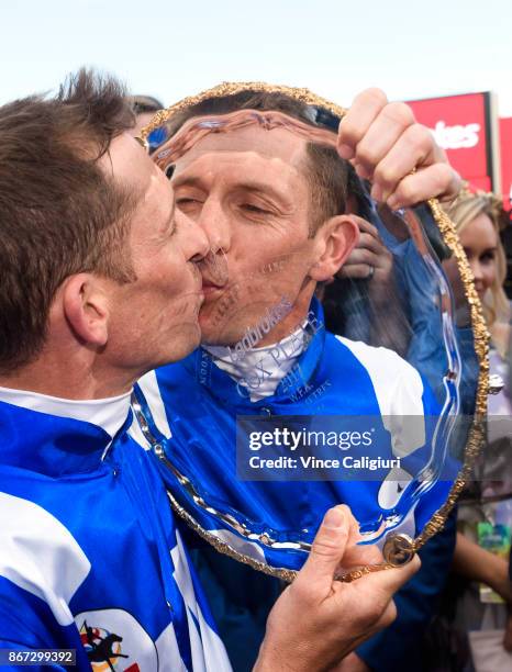 Hugh Bowman kisses the plate after riding Winx to win Race 9, Ladbrokes Cox Plate during Cox Plate Day at Moonee Valley Racecourse on October 28,...