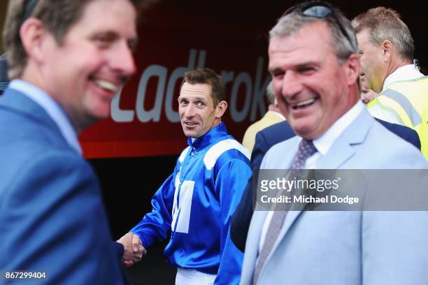 Winx winning jockey by Hugh Bowman reacts to trainer Darren Weir who came second with Humidor race 9 the Ladbrokes Cox Plate during Cox Plate Day at...