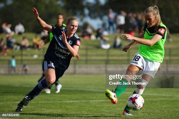Natasha Dowie of the Victory and Taren King of Canberra compete for the ball during the round one W-League match between Melbourne Victory and...