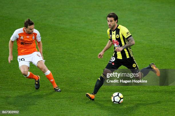 Tom Doyle of the Phoenix looks to evade Jack Hingert of Brisbane during the round four A-League match between the Wellington Phoenix and the Brisbane...