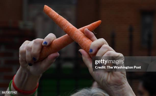 Many marchers held healthy food items in the air to make the point about the lack of fresh food available in poorer areas of the city. Pege...