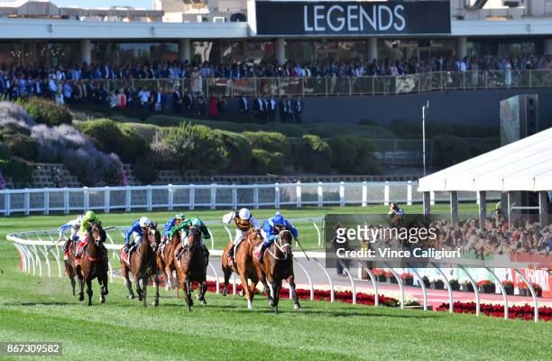 Hugh Bowman riding Winx defeats Blake Shinn riding Humidor in Race 9, Ladbrokes Cox Plate during Cox Plate Day at Moonee Valley Racecourse on October...