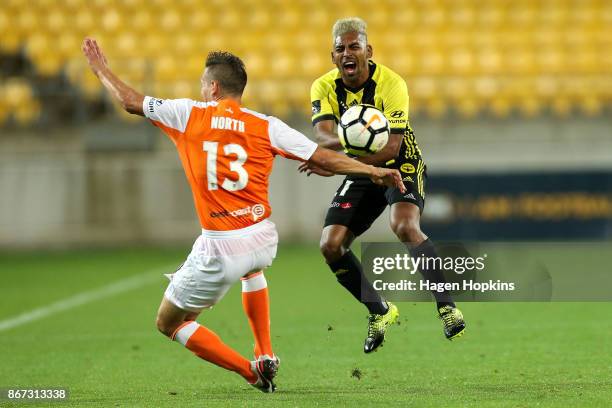 Roy Krishna of the Phoenix is tackled by Jade North of Brisbane during the round four A-League match between the Wellington Phoenix and the Brisbane...