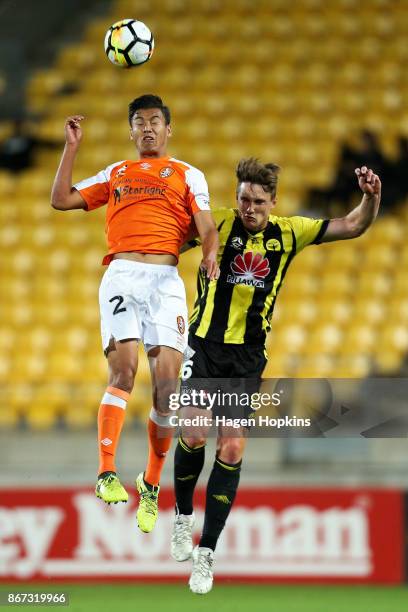 Dane Ingham of Brisbane and Dylan Fox of the Phoenix compete for a header during the round four A-League match between the Wellington Phoenix and the...