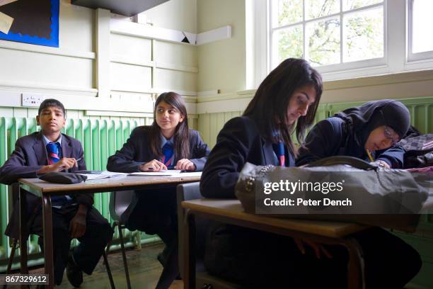 Year old year 11 pupil Laiba Abbasi in a Maths lesson at Villiers High School. She is studying hard in class for her mock GCSE exams. Villiers High...