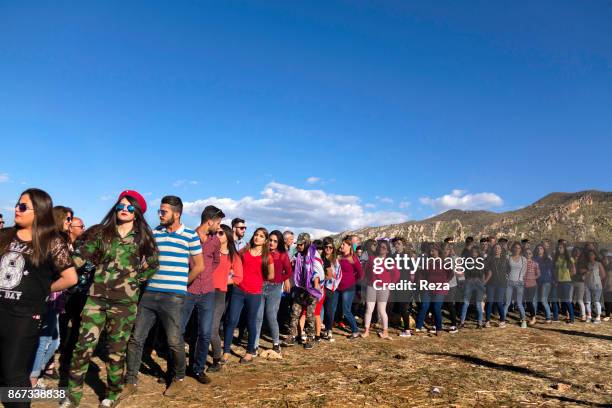 Dances of young people wearing western clothes and Peshmerga military uniform during a festive annual gathering of Assyrians on the morning after...