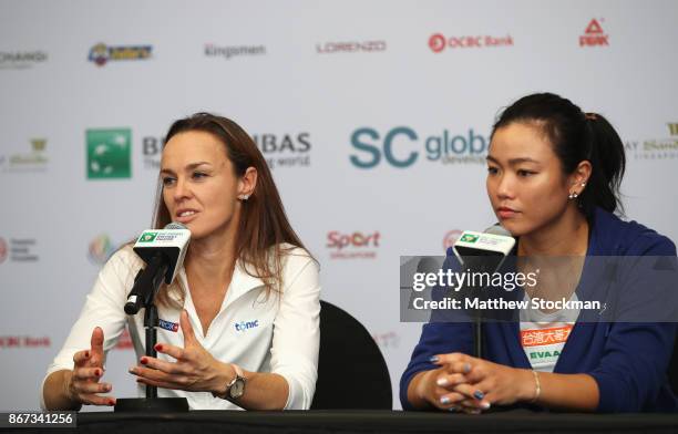 Martina Hingis of Switzerland talks in a press conference in her final tournament with Chan Yung-Jan of Chinese Taipei after their defeat in the...