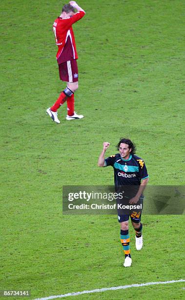 Claudio Pizarro of Werder Bremen celebrates his goal while Marcell Jansen of Hamburg looks dejected during the UEFA Cup Semi Final second leg match...