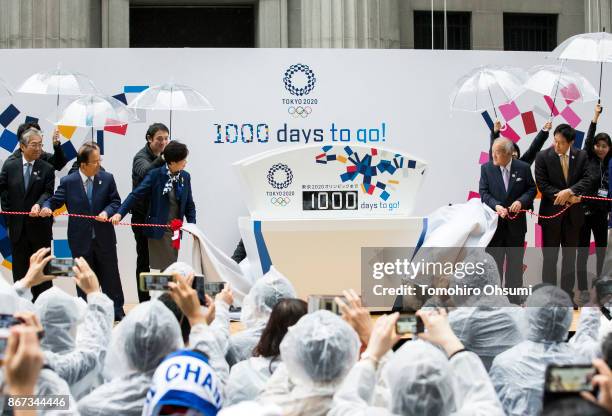 Japanese Olympic Committee President Tsunekazu Takeda, Tokyo 2020 Chief Executive Officer Toshiro Muto, Tokyo Governor Yuriko Koike, and Shunichi...