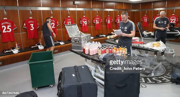 Alec Wylie, kit manager of Manchester United, and his staff lay out the kit ahead of the Premier League match between Manchester United and Tottenham...
