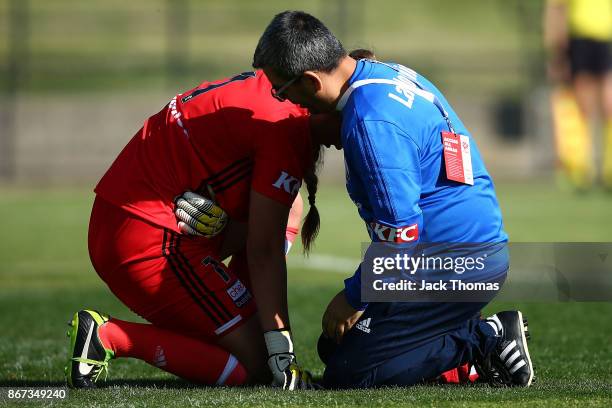 Casey Dumont of the Victory reacts after being hit during the round one W-League match between Melbourne Victory and Canberra United at Epping...