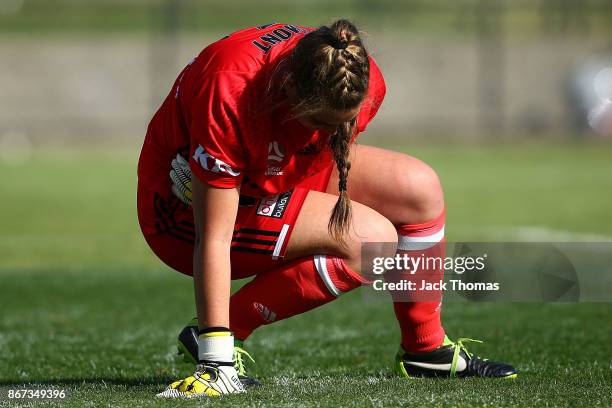 Casey Dumont of the Victory reacts after being hit during the round one W-League match between Melbourne Victory and Canberra United at Epping...