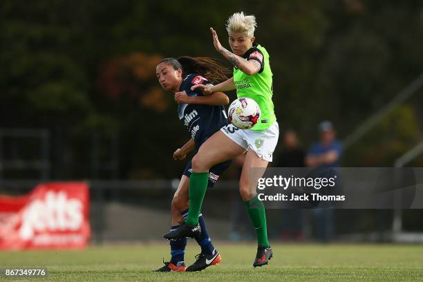 Michelle Heyman of Canberra compete for the ball during the round one W-League match between Melbourne Victory and Canberra United at Epping Stadium...