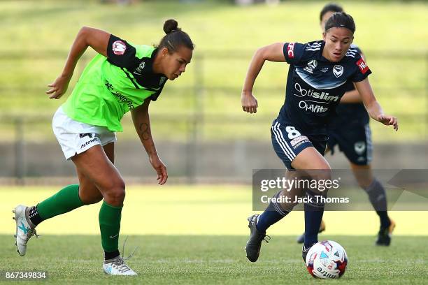 Angela Beard of the Victory runs with the ball during the round one W-League match between Melbourne Victory and Canberra United at Epping Stadium on...