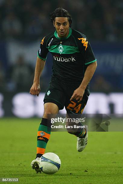 Claudio Pizarro of Bremen runs with the ball during the UEFA Cup Semi Final second leg match between Hamburger SV and SV Werder Bremen at the HSH...