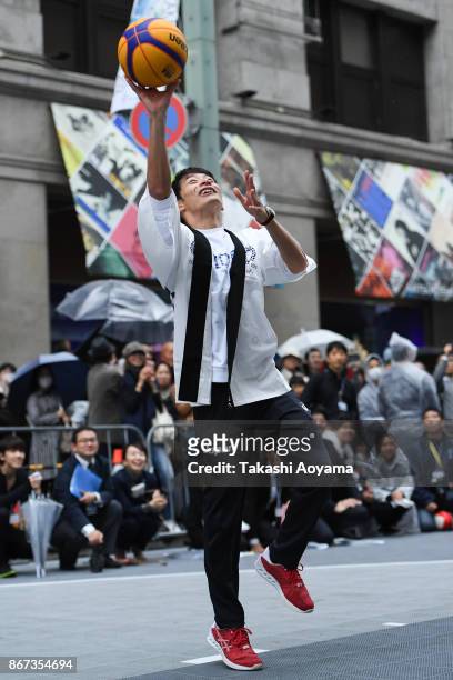 Swimmer Ryosuke Irie shoots during the 3x3 basketball demonstration as part of the Tokyo 2020 Olympic 1,000 Days Countdown event on October 28, 2017...