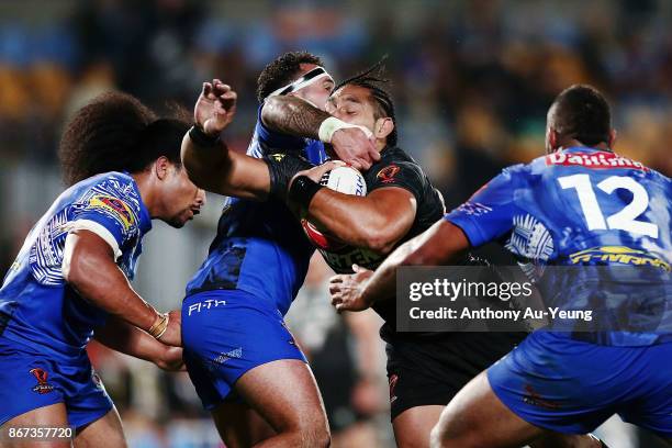 Martin Taupau of the Kiwis is tackled by Jazz Tevaga of Samoa during the 2017 Rugby League World Cup match between the New Zealand Kiwis and Samoa at...