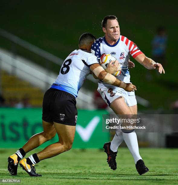 Matt Shipway of the USA is tackled by Brayden Wiliame of Fiji during the 2017 Rugby League World Cup match between Fiji and the United States on...