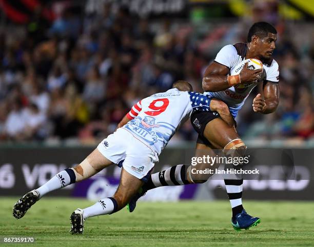 Tui Kamikamica of Fiji is tackled by David Marando of the USA during the 2017 Rugby League World Cup match between Fiji and the United States on...