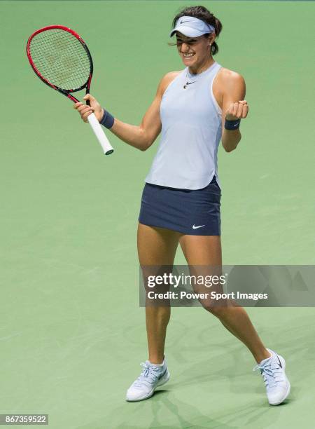 Caroline Garcia of France celebrates victory in her singles match against Caroline Wozniacki of Denmark during day 6 of the BNP Paribas WTA Finals...