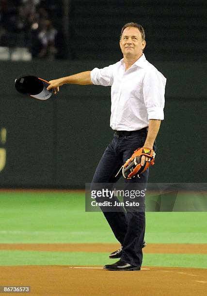 Actor Tom Hanks throws the ceremonial first pitch prior to the professional baseball match between Yomiuri Giants and Chunichi Dragons at Tokyo Dome...