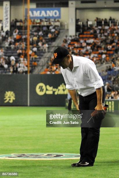 Actor Tom Hanks looks on during the ceremonial first pitch prior to the professional baseball match between Yomiuri Giants and Chunichi Dragons at...