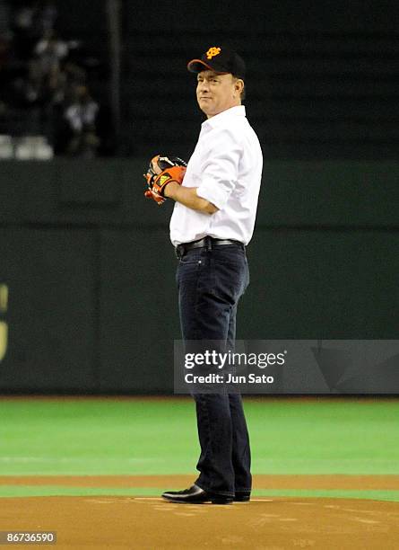 Actor Tom Hanks throws the ceremonial first pitch prior to the professional baseball match between Yomiuri Giants and Chunichi Dragons at Tokyo Dome...