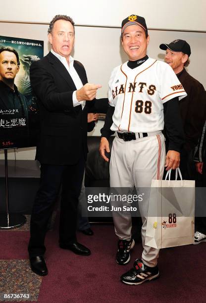 Yomiuri Giants coach Tatsunori Hara and actor Tom Hanks meet press at the reception room during professional baseball match between Yomiuri Giants...